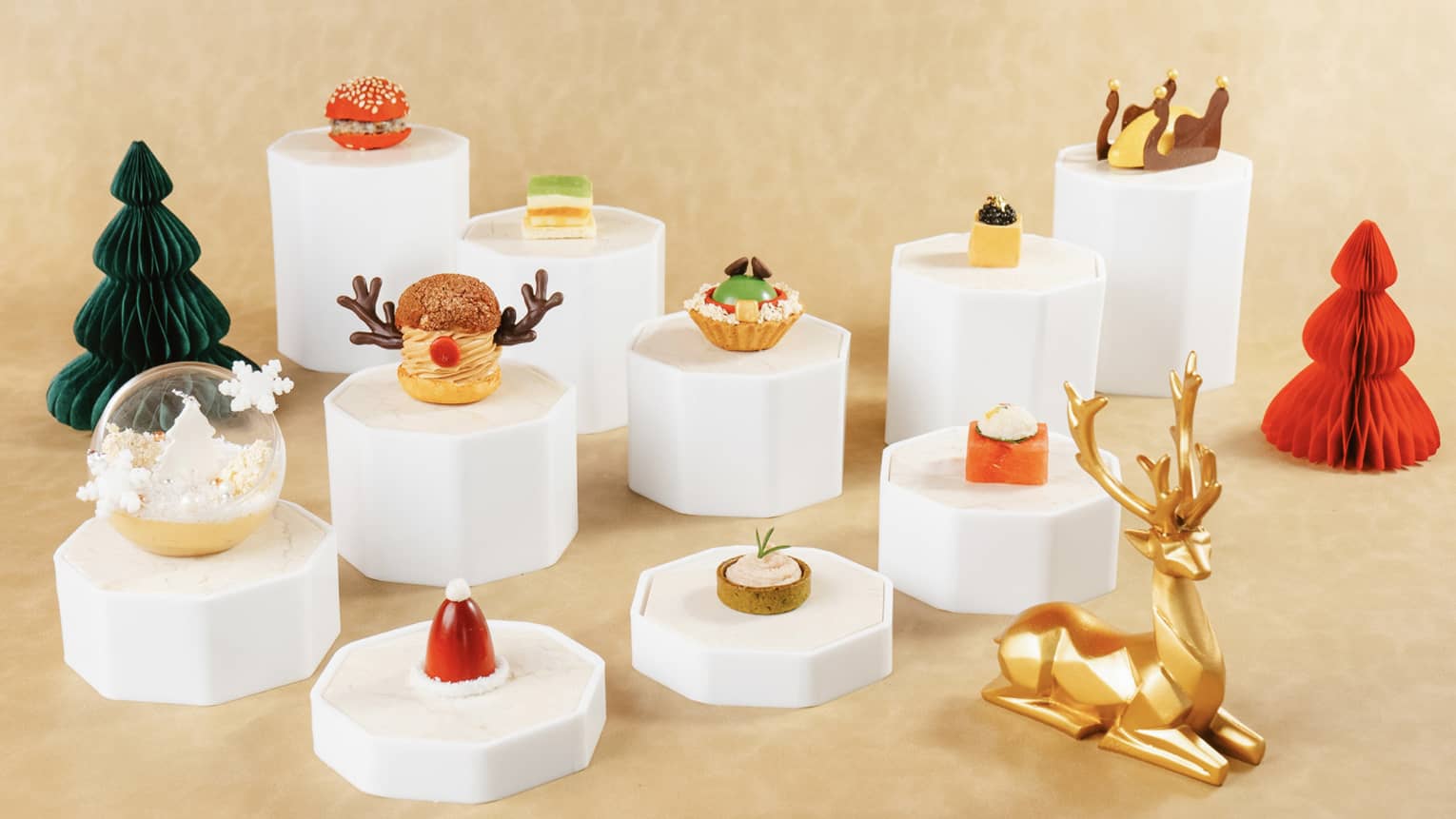 Festive afternoon tea sweets and savouries on mini white pedestals