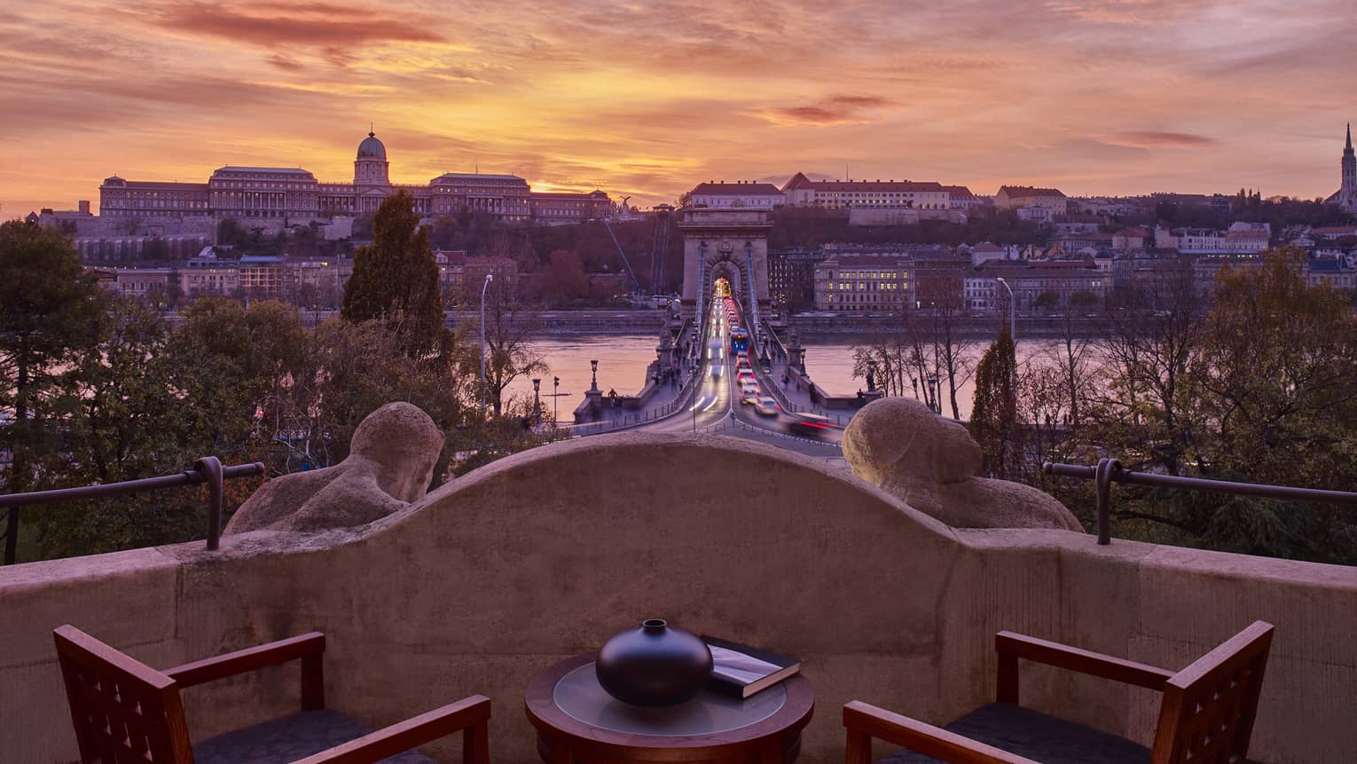 Royal Suite stone balcony with Danube River and Budapest view at sunset