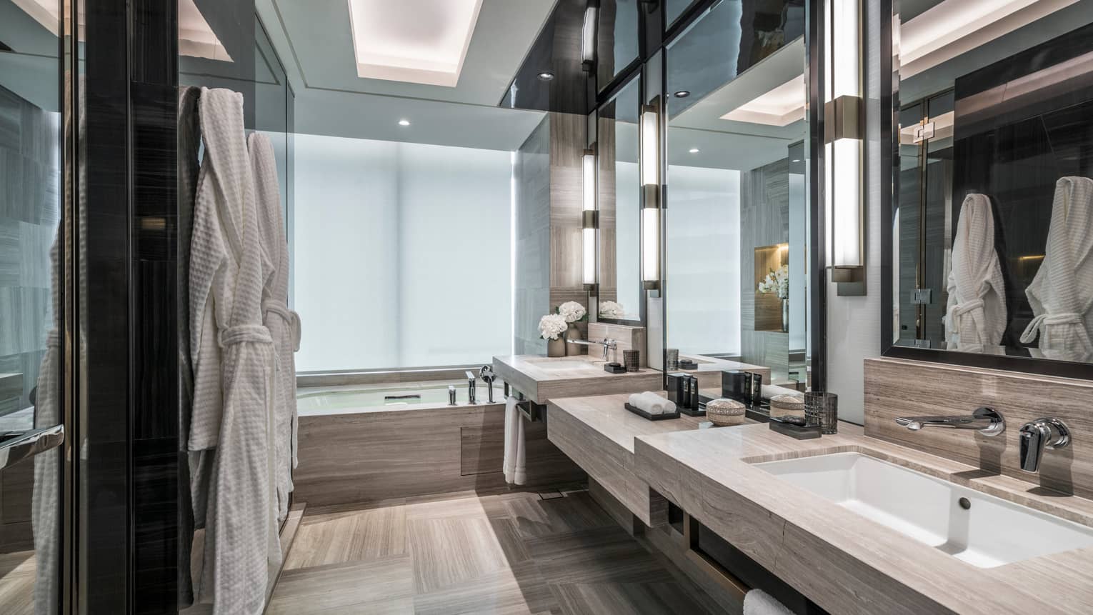 Corner Room Bathroom with robes hanging on the wall