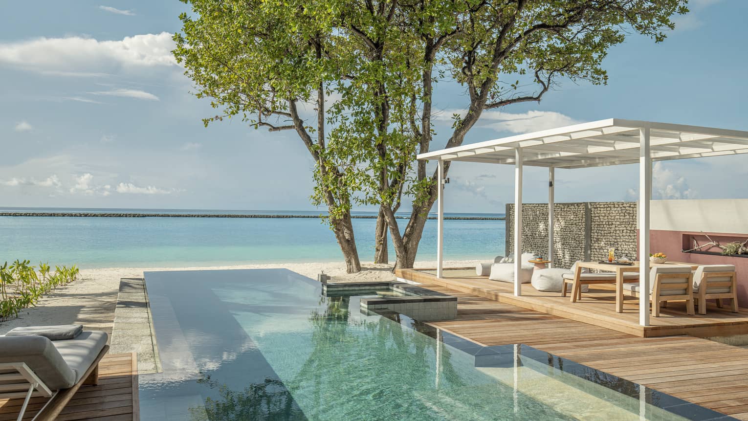 Private pool and lounge deck overlooking Maldivian ocean