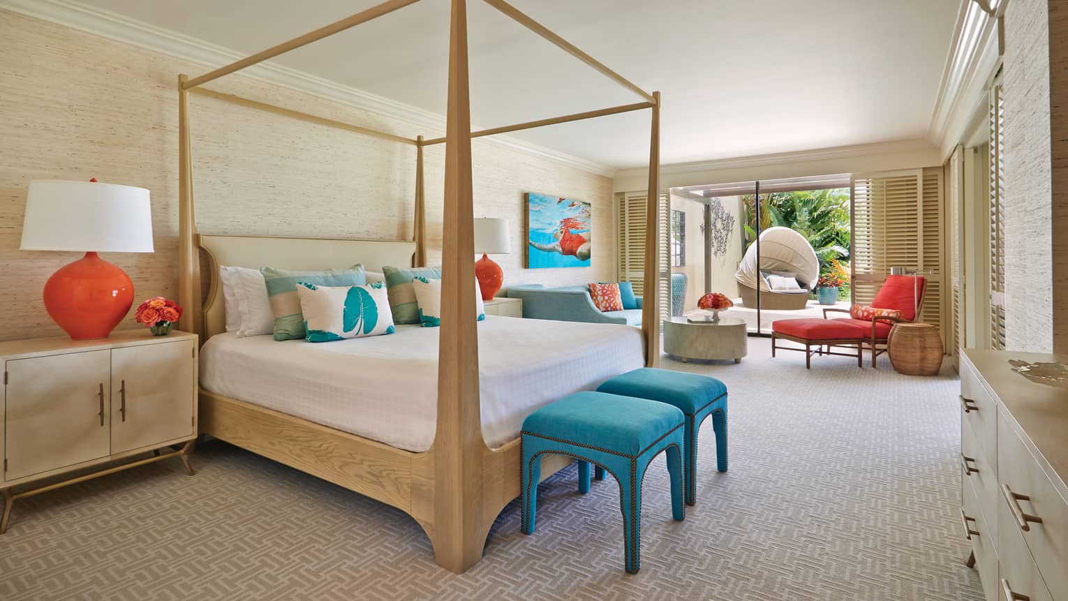 Lokelani Suite master bedroom with four poster bed and doors leading onto deck