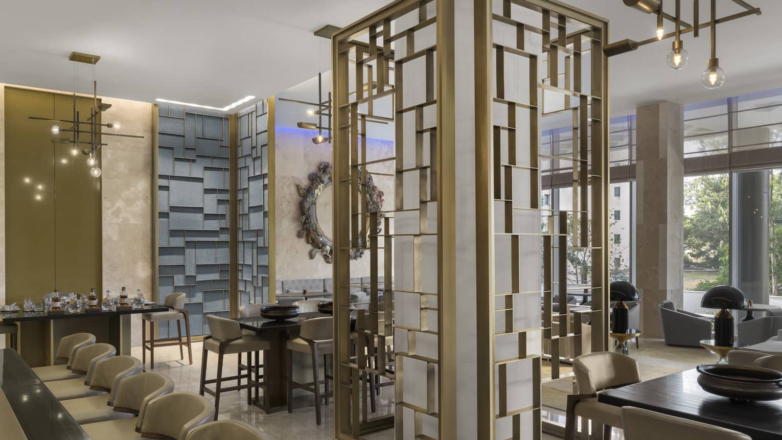 Sculptural lights and geometric metal panels decorate The Collection