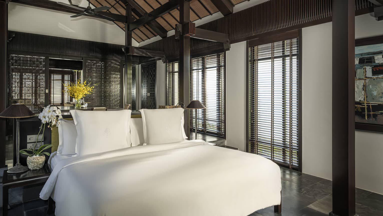King bed in a private villa with vaulted ceiling