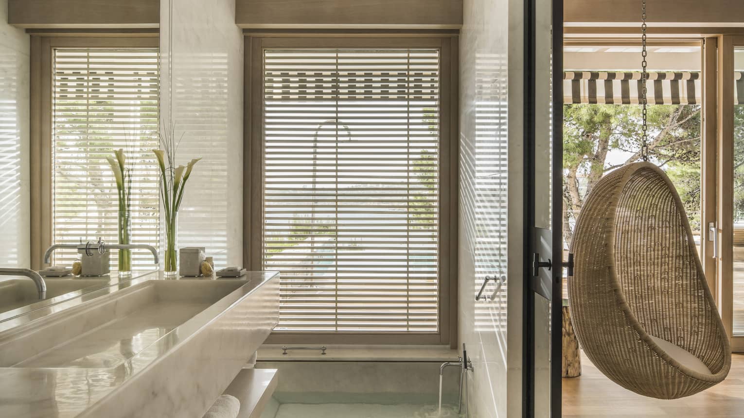 Bungalow Suite with Pool Bathroom, full-width marbled vanity and mirror, hanging rattan egg chair