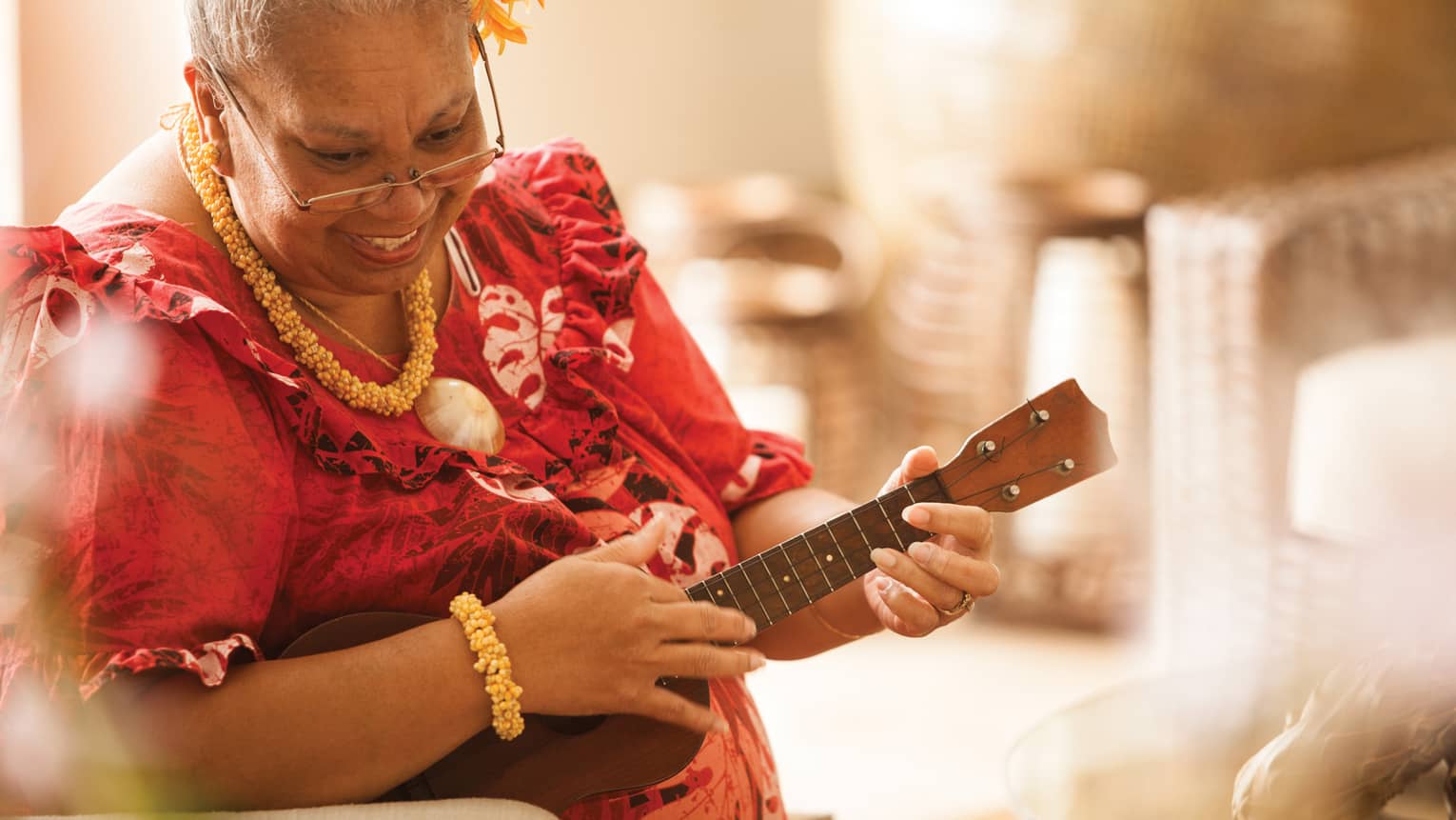Close-up of Hawaiian elder playing ukulele