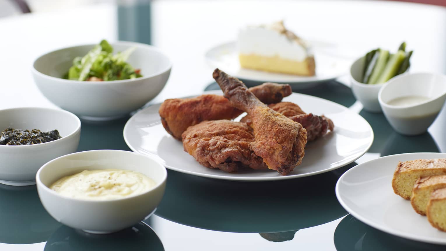 Marunouchi Fried Chicken with Cobb Salad & Kale Dressing, Braised Kale, Mashed Potatoes, Cornbread, House-made Pickles, Ranch Dressing and Lemon Meringue Pie