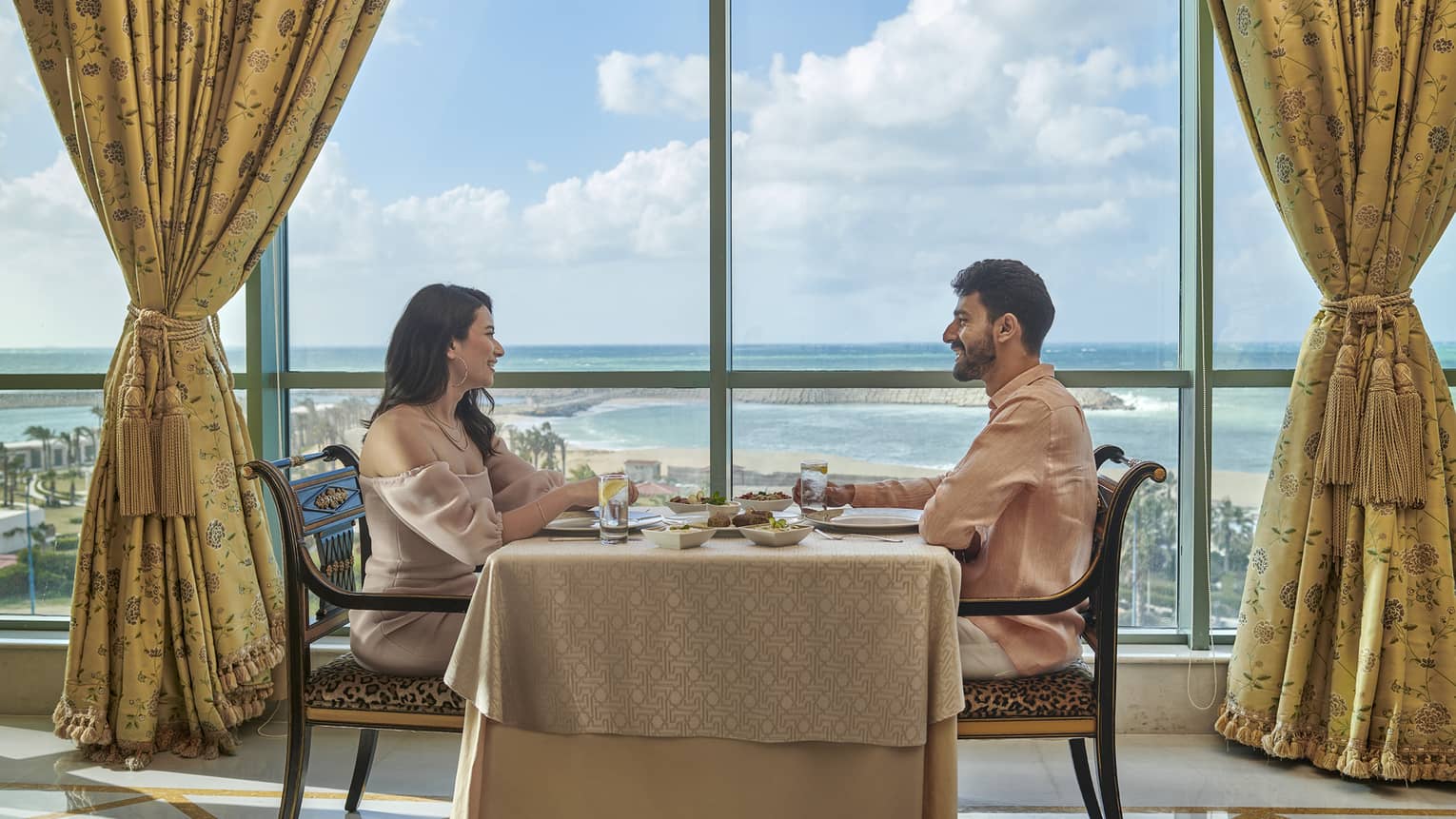 Couple enjoys a meal at Byblos Restaurant with views of the Mediterranean Sea