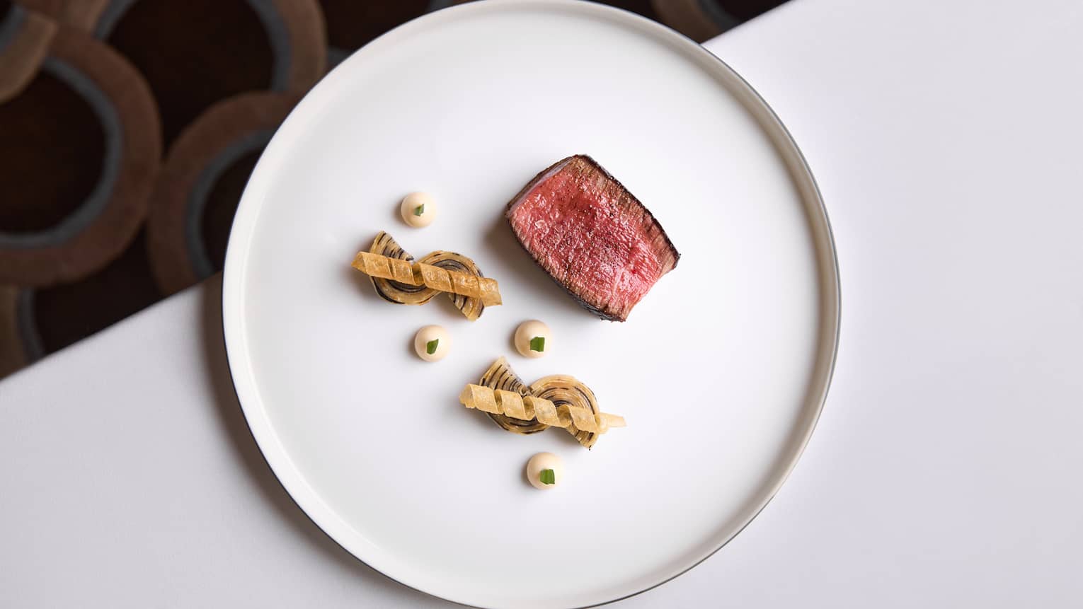 Fine dining plate with sliced piece of filet mignon
