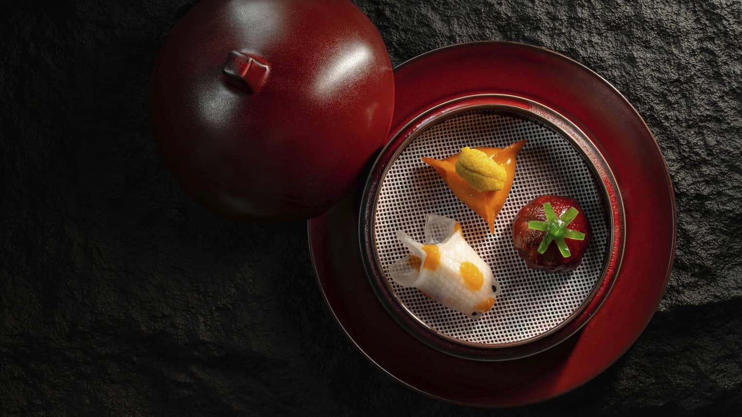 Assorted dim sum in red clay pot