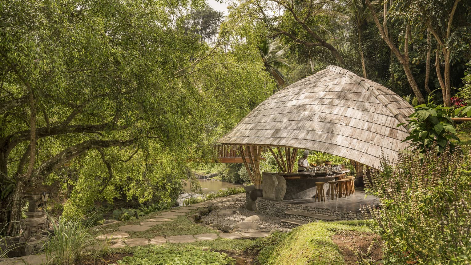 Four Seasons guests attend Sokasi Cooking School in an outdoor pavillion