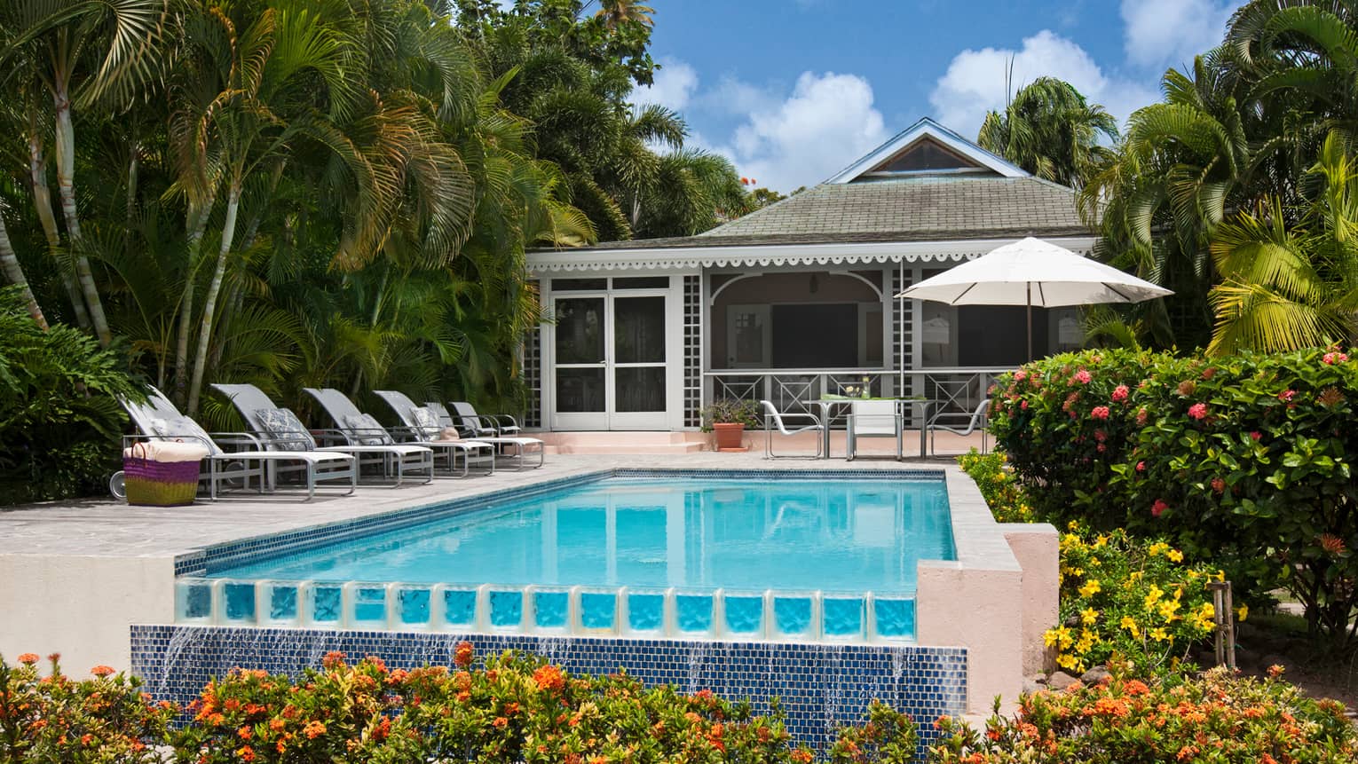 Palm Grove Resort Residence outdoor swimming pool, lounge chairs on deck
