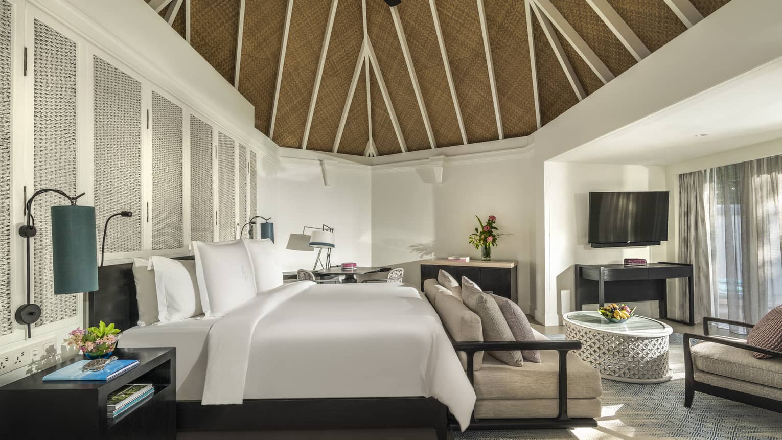 Master bedroom with king bed, sofa and vaulted ceiling