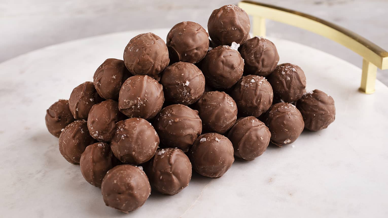 White marble platter stacked with Salty Caramel Truffles