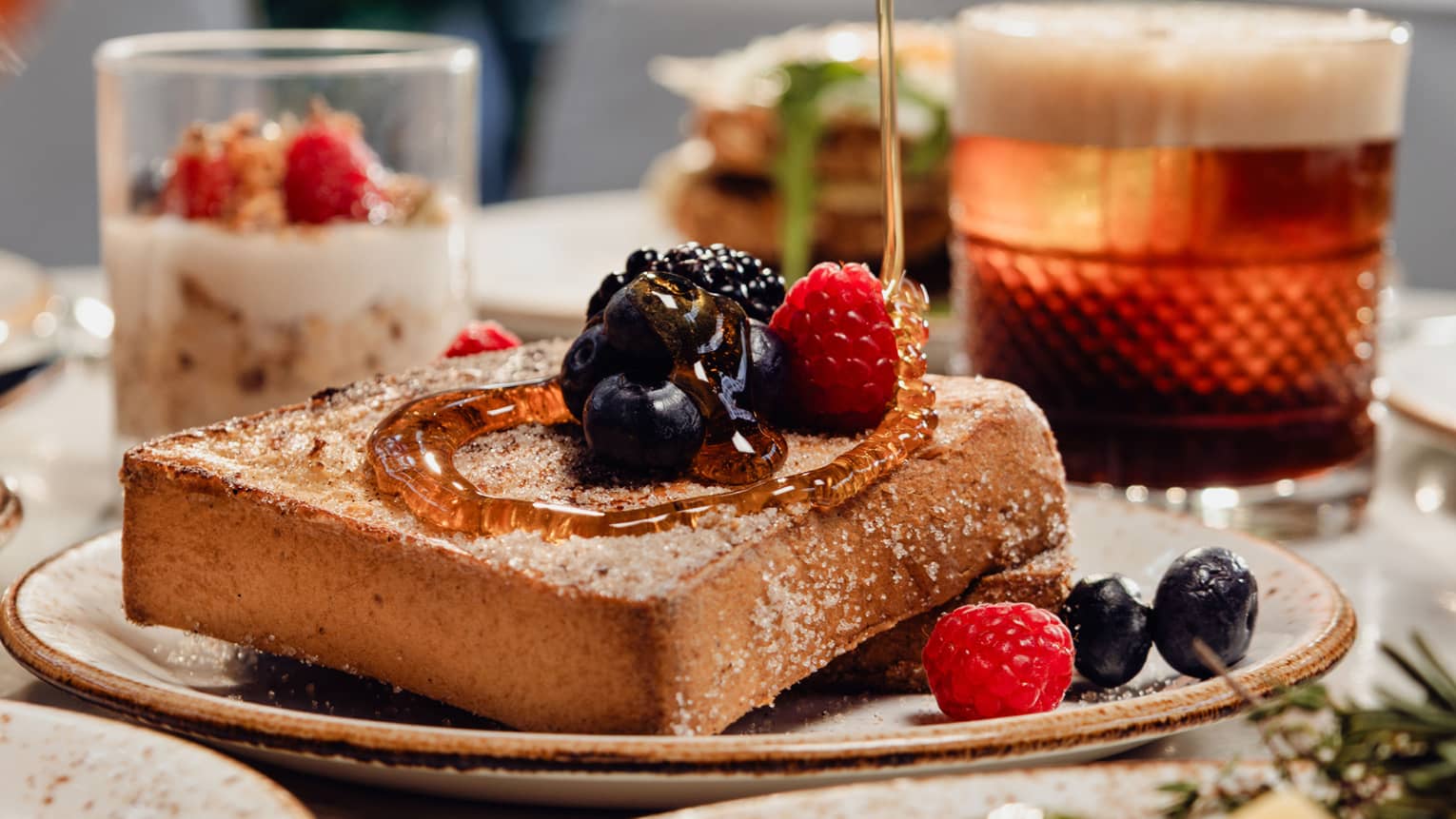 French toast being drizzled with syrup