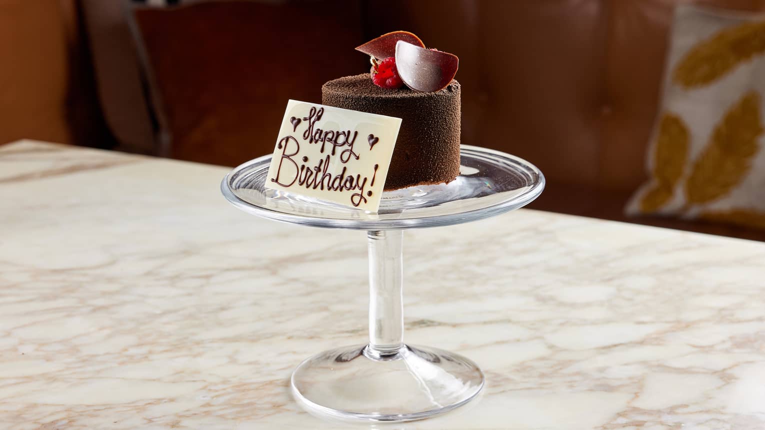 A small chocolate dessert on a tray.