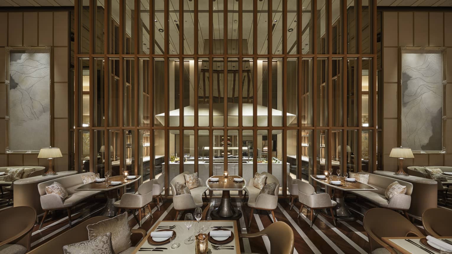 Sophisticated dining area at est, a Michelin-star restaurant in Tokyo, with an open kitchen and elegant decor.