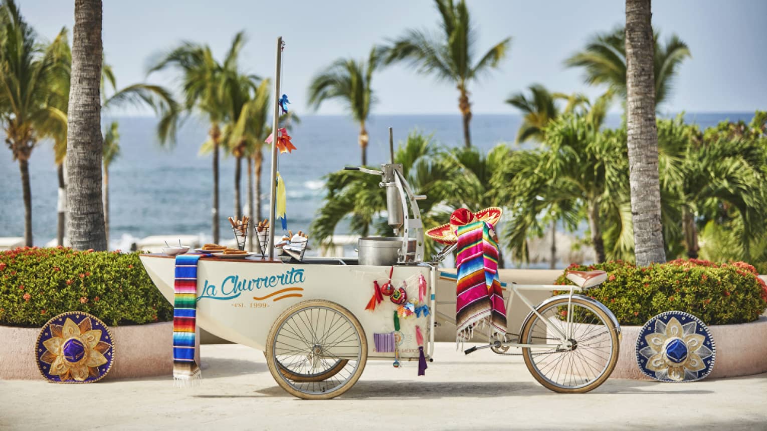 A playful "Churro Cart" set along the beach