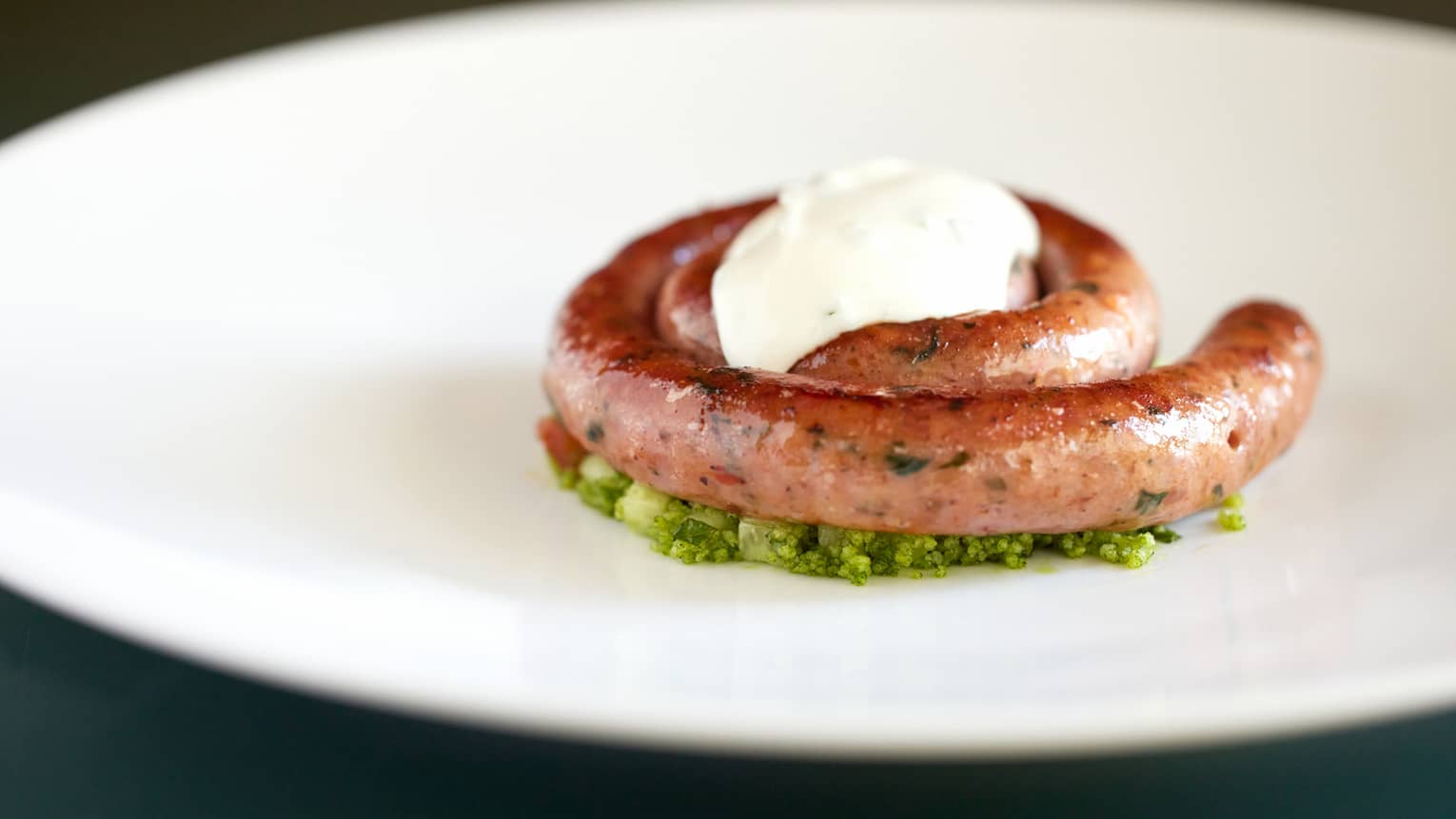 Merguez Sausage coil with Tabbouleh and Mint Yoghurt