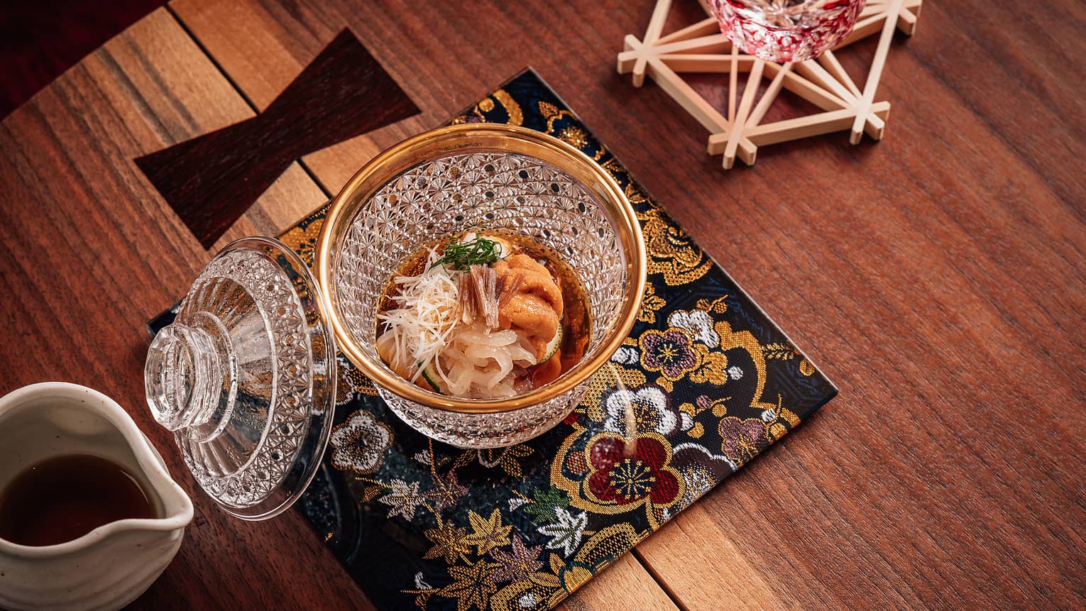White shrimp is paired with creamy sea urchin in a glass bowl