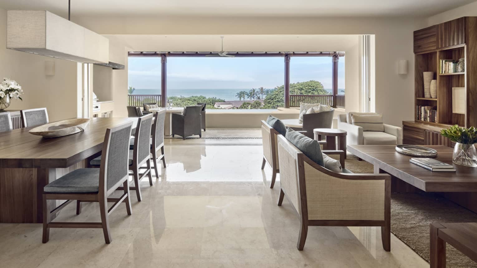 Living room and dining area with ocean view