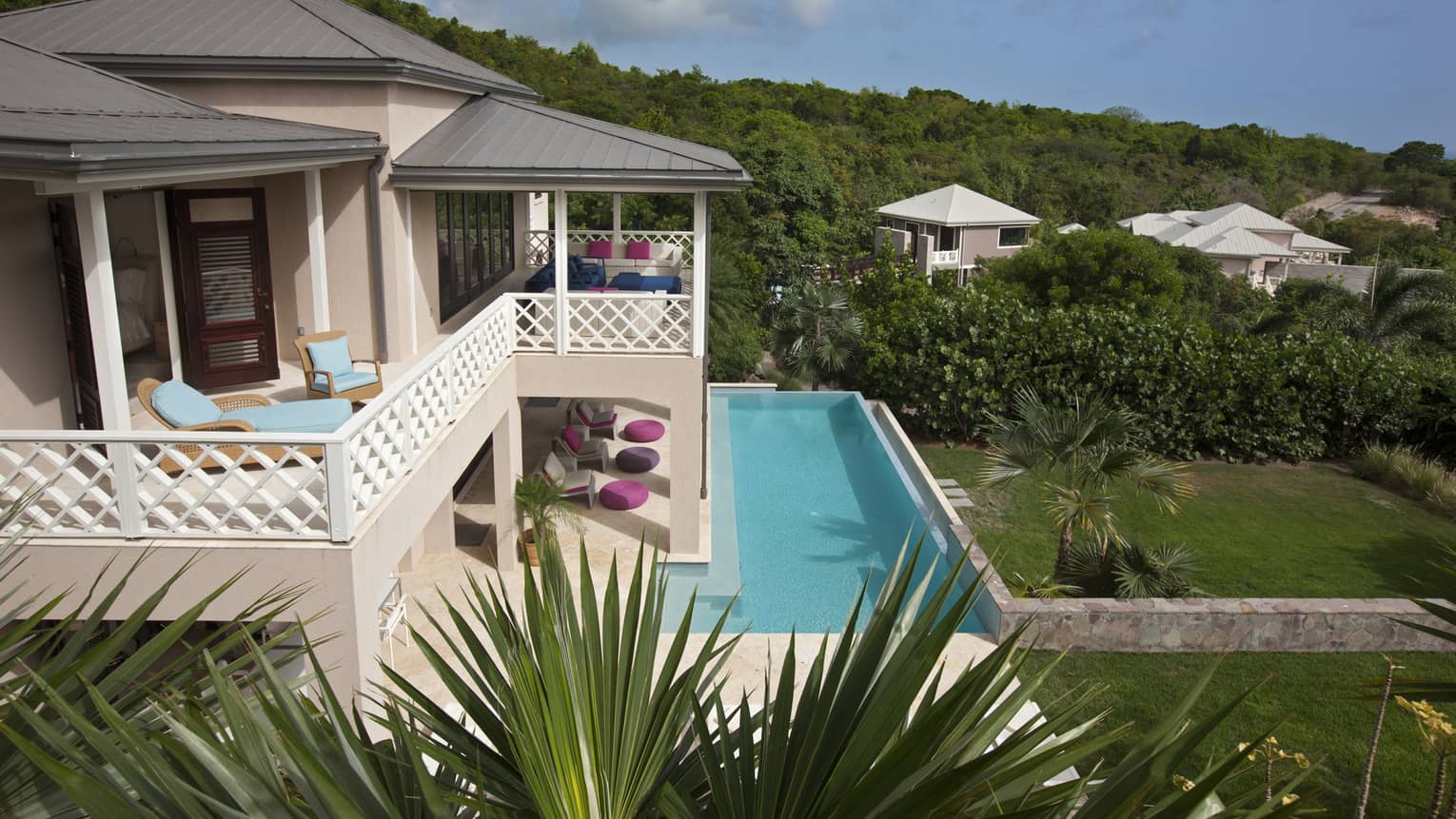 Looking down over Stewarts Residence pink exterior, upstairs balcony, outdoor pool