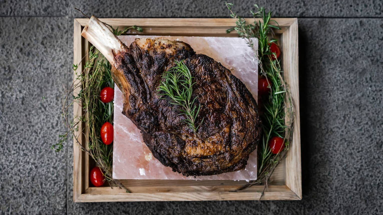 Waggyu beef tomahawk with potato puree, da lat spinach, sautéed vegetables, salad leaves, bread dumpling, jus, mustard and bearnaise