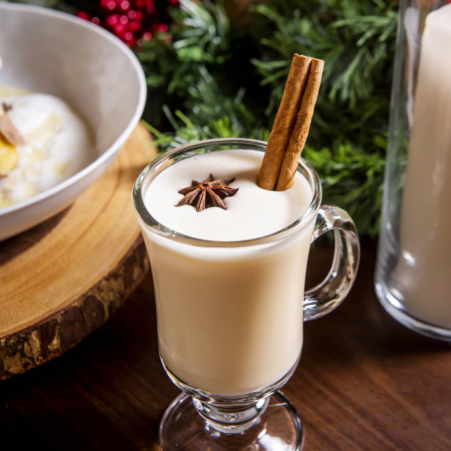 A cocktail with vanilla pod and spices in it.