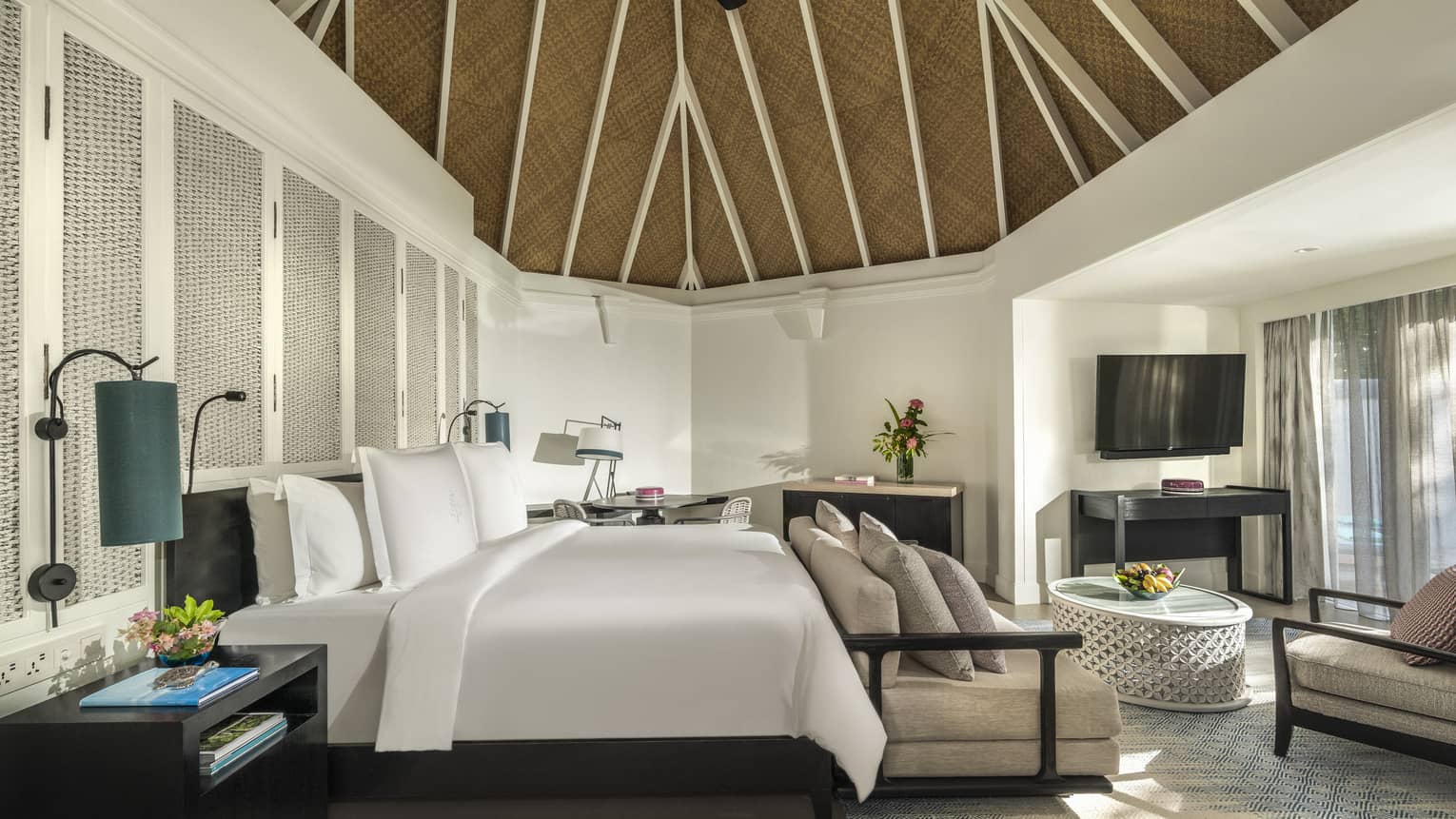 Master bedroom with king bed, sofa and vaulted ceiling