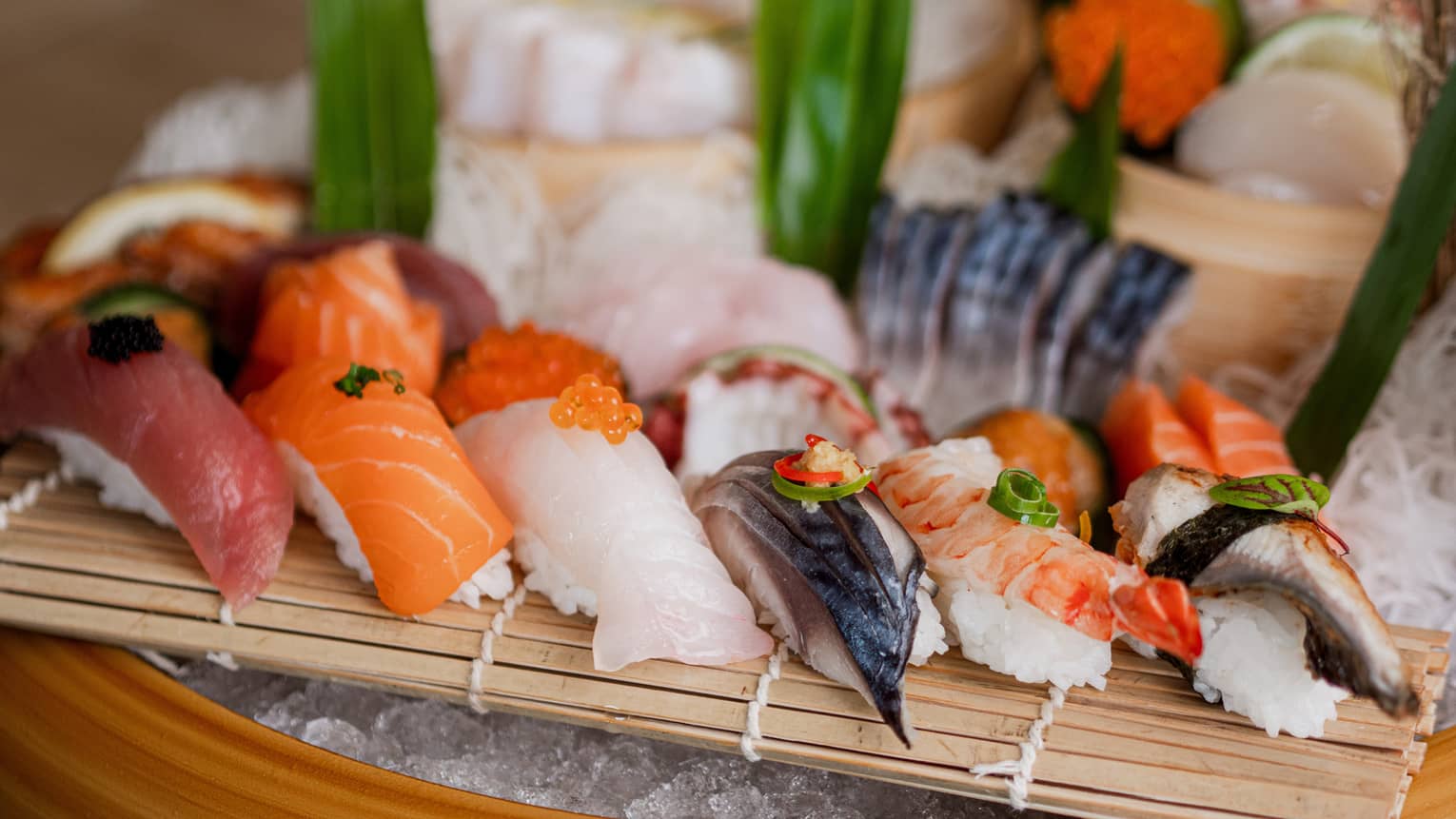 An assortment of sushi on ice.