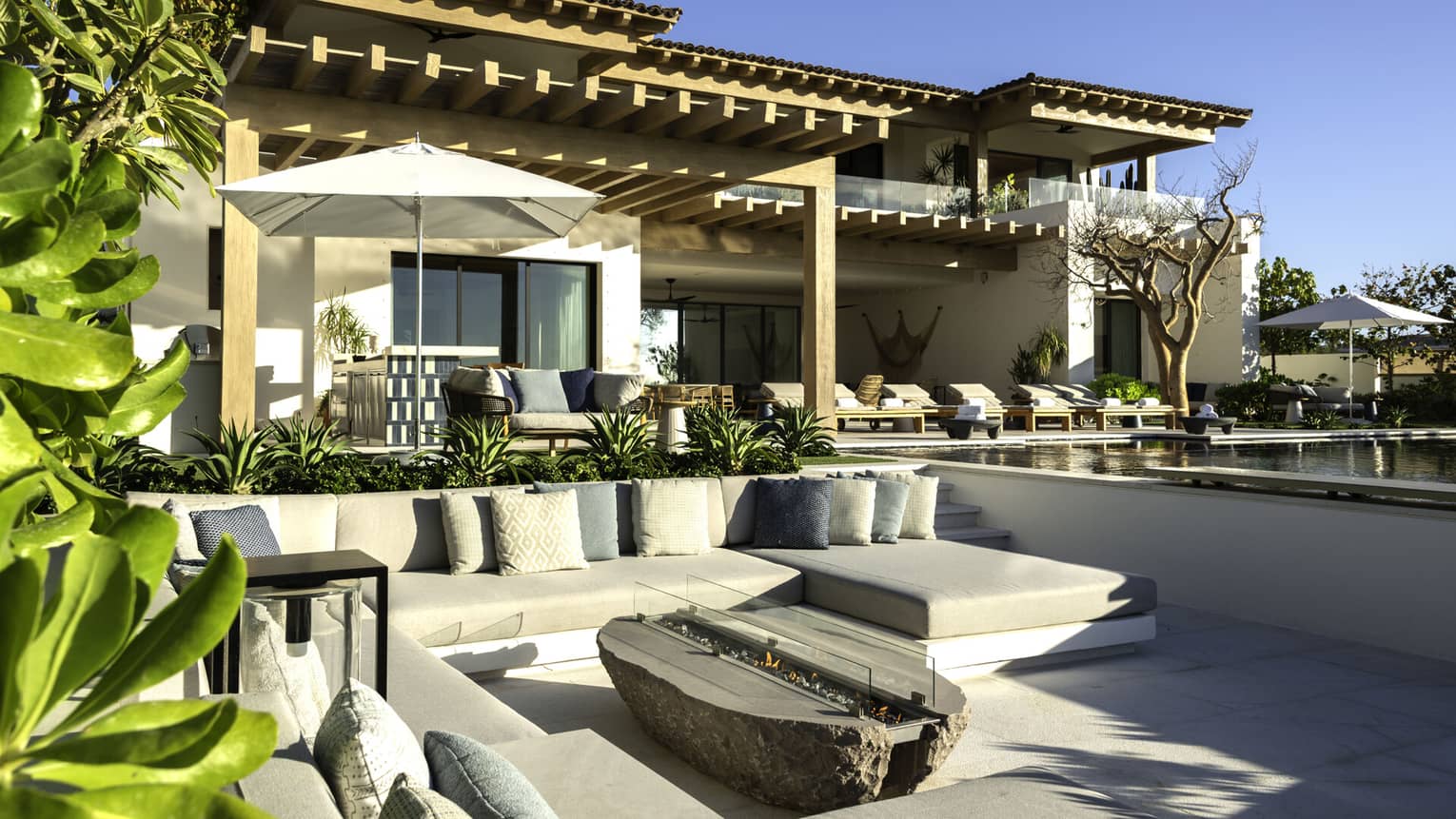 Large private villa with outdoor pergola and sunken fire pit lounge area 