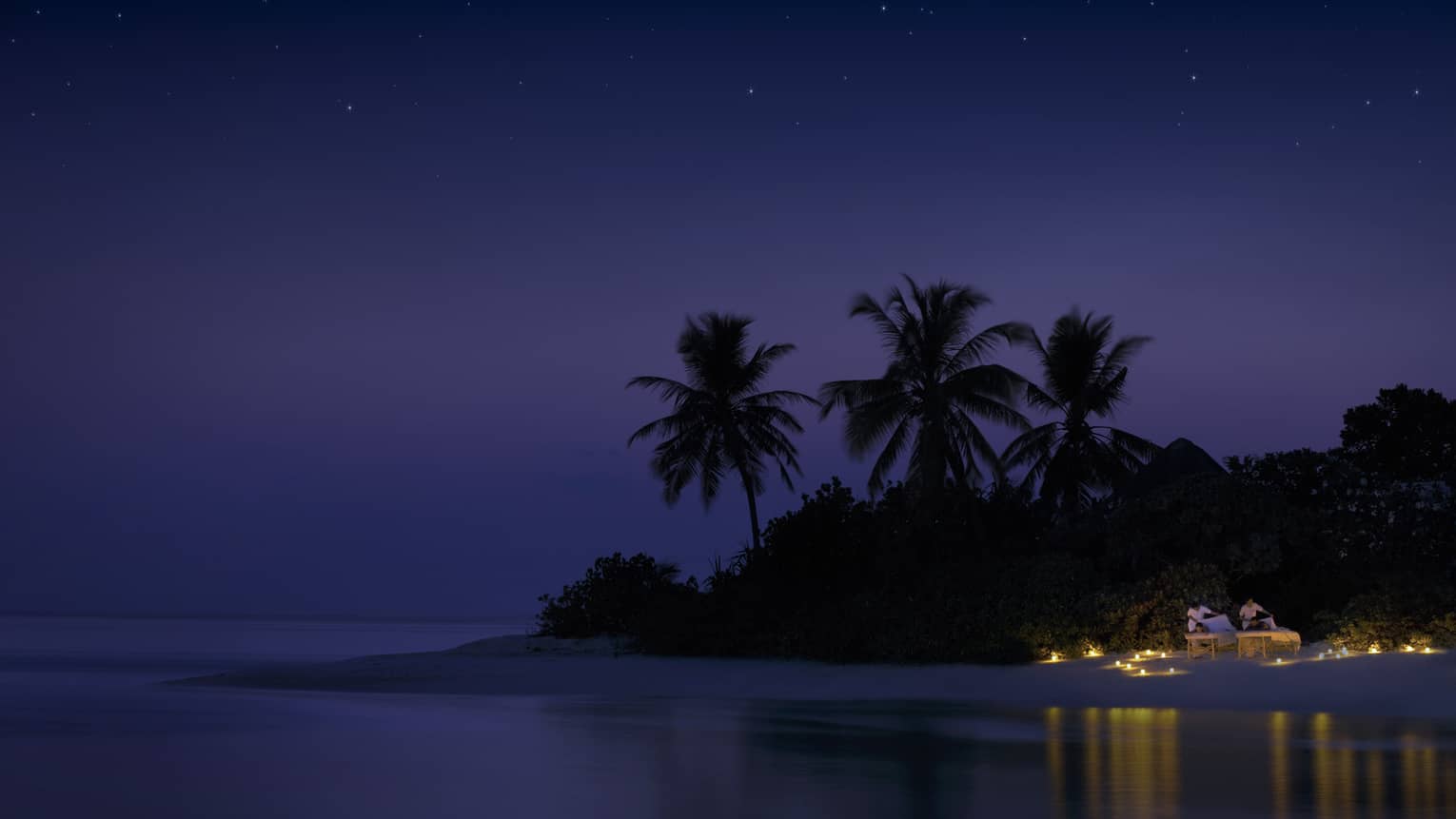 Night view of spa rituals, two guests have massages on candlelit beach under starry sky