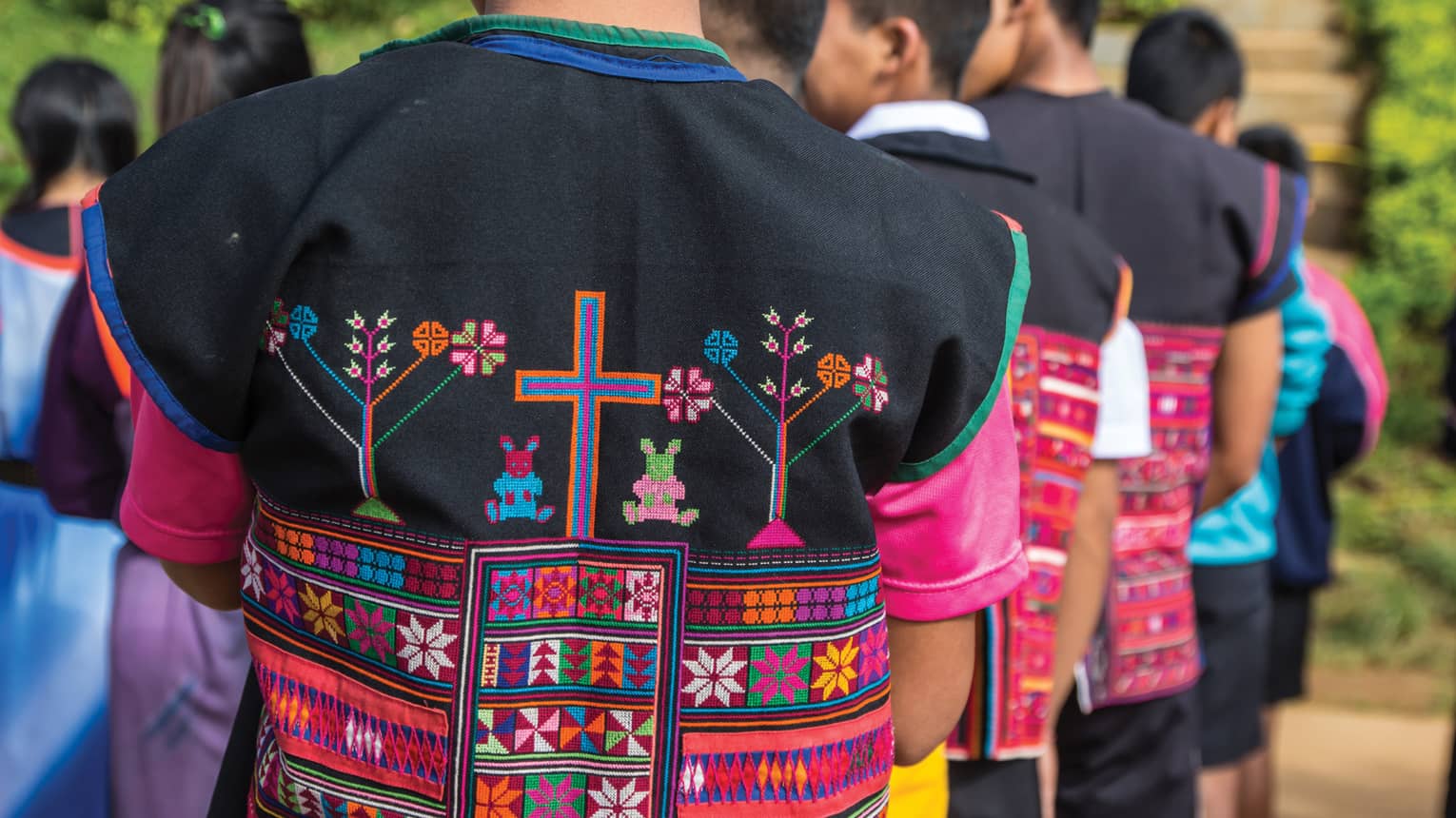 Close-up of colourful textiles on clothing made by hill tribes