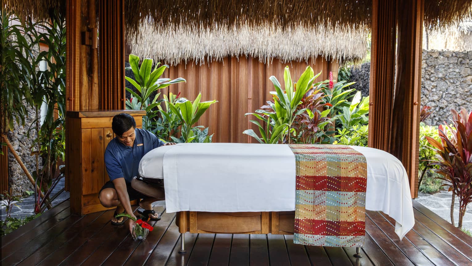 A wellness specialist preparing for a massage