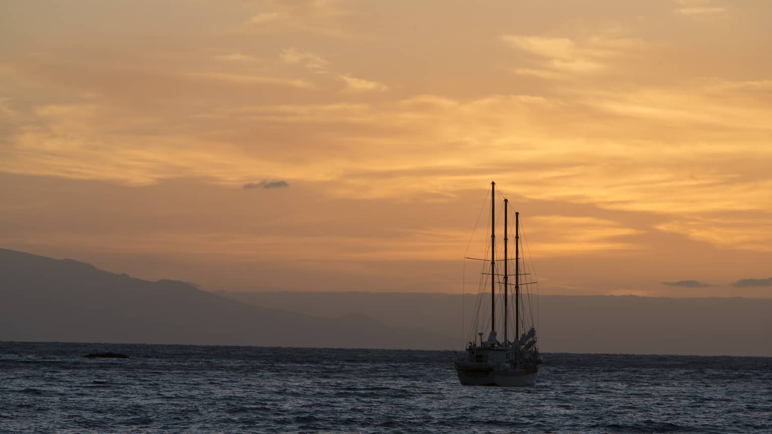 The Resort's catamaran sets sail at sunset