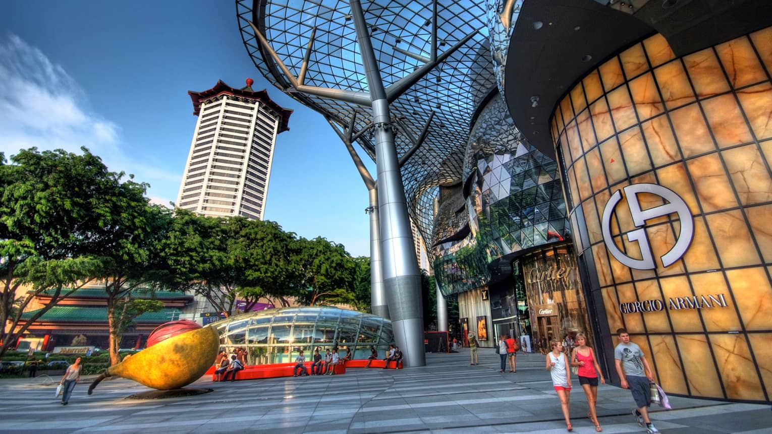 ,People walking outside of a modern shopping mall