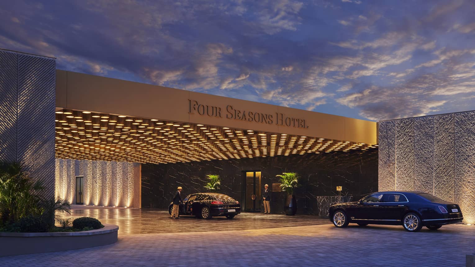 Modern Four Seasons Hotel Casablanca entrance at nights with lights, luxury cars