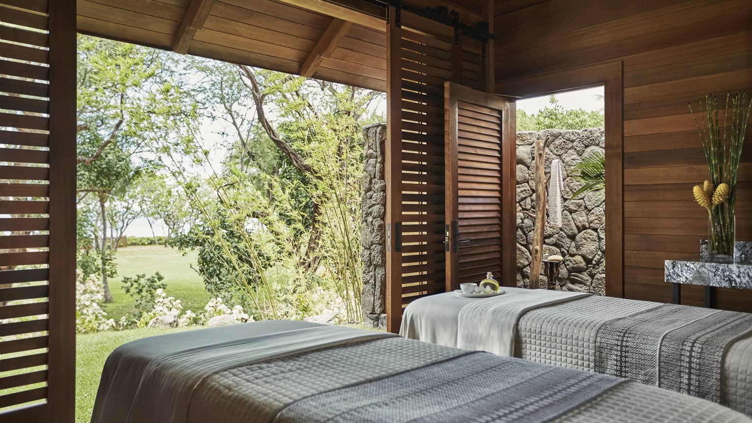Spa Hale Couples Room side-by-side in pavillions with open sliding wood shutters