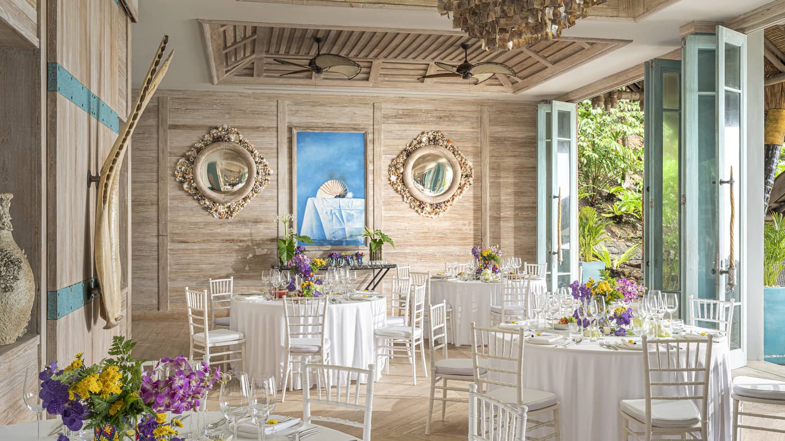 Open-air Beach House set up with banquet tables