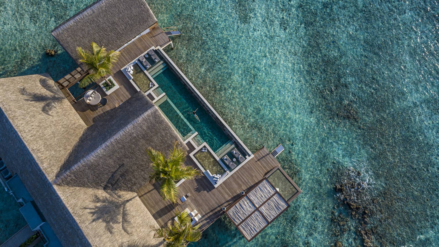 Aerial view of overwater villa with pool