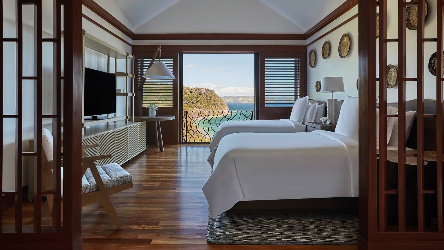 Canopy Suite Double Beds with Open Door Views of the Ocean