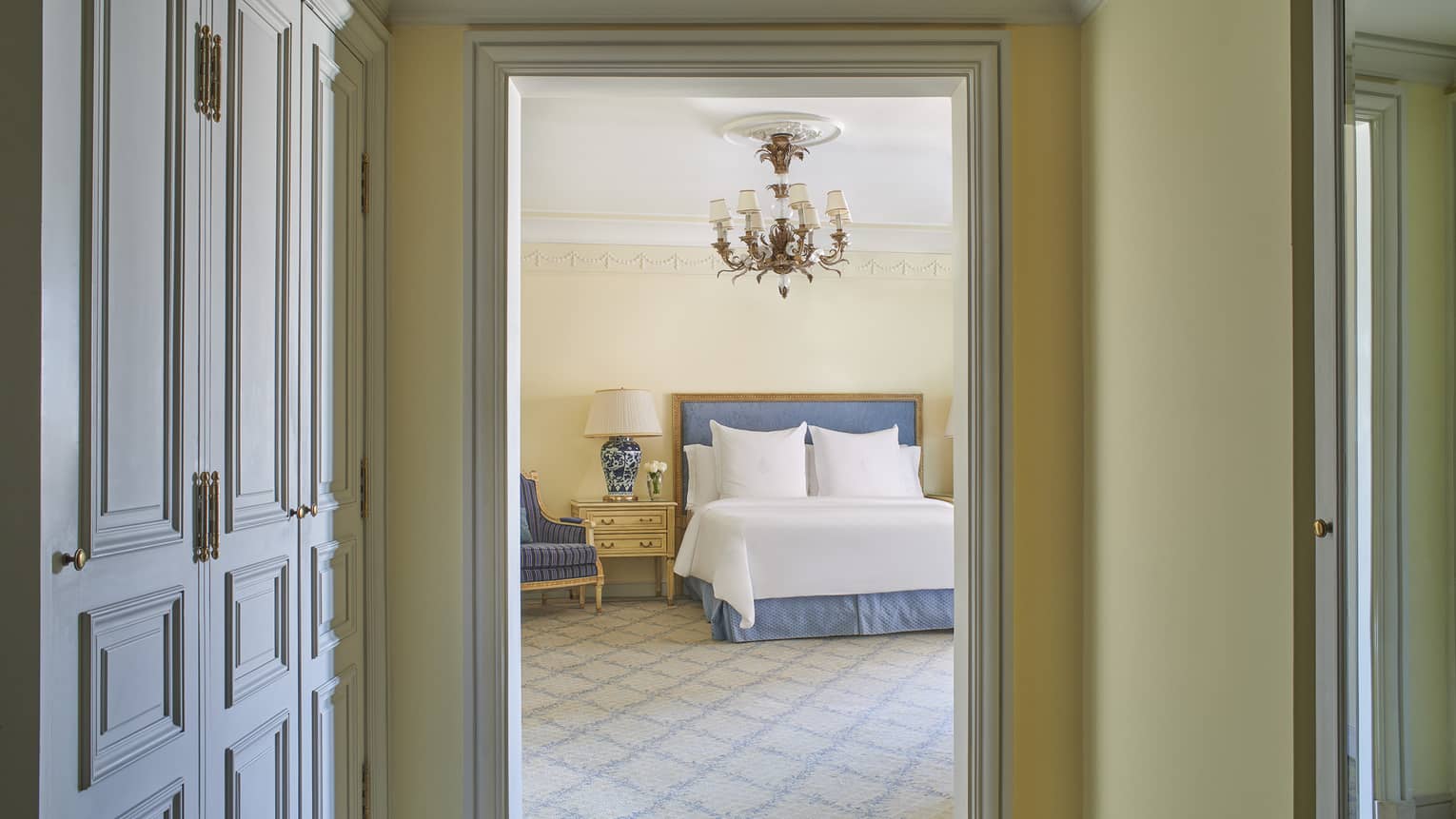 Deluxe Two Bedroom Suite hallway with bed visible