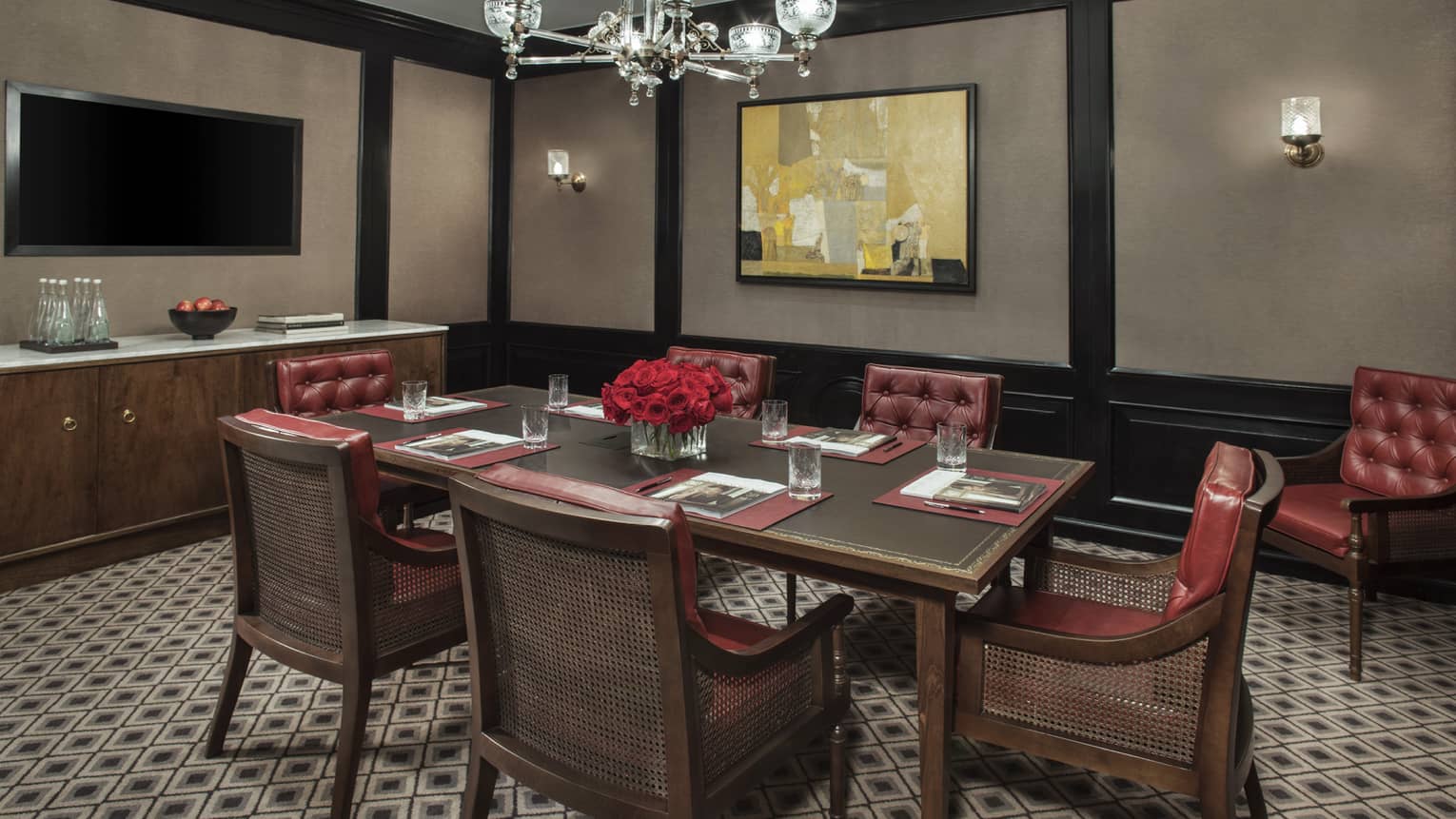 Margot Meeting Room with small boardroom table for six with tufted red leather chairs 