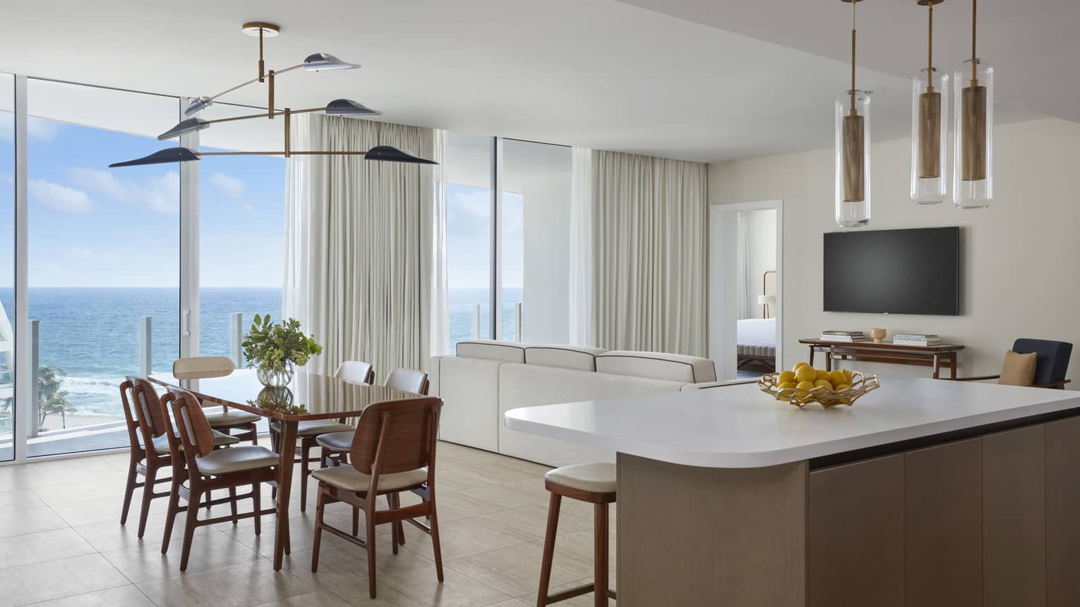 Kitchen island and dining table with ocean view