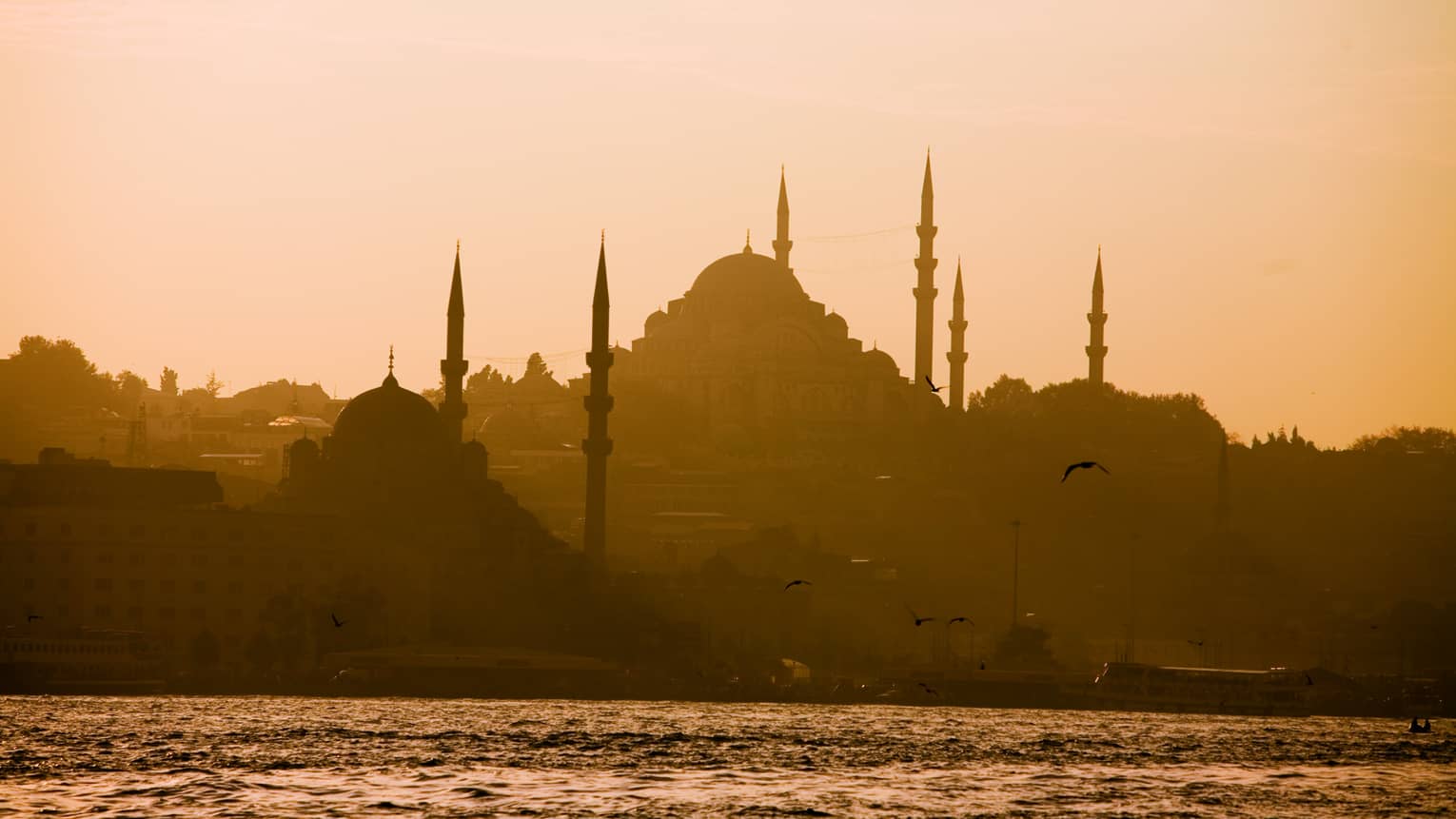 Silhouette of domed Blue Mosque in Istanbul at sunset