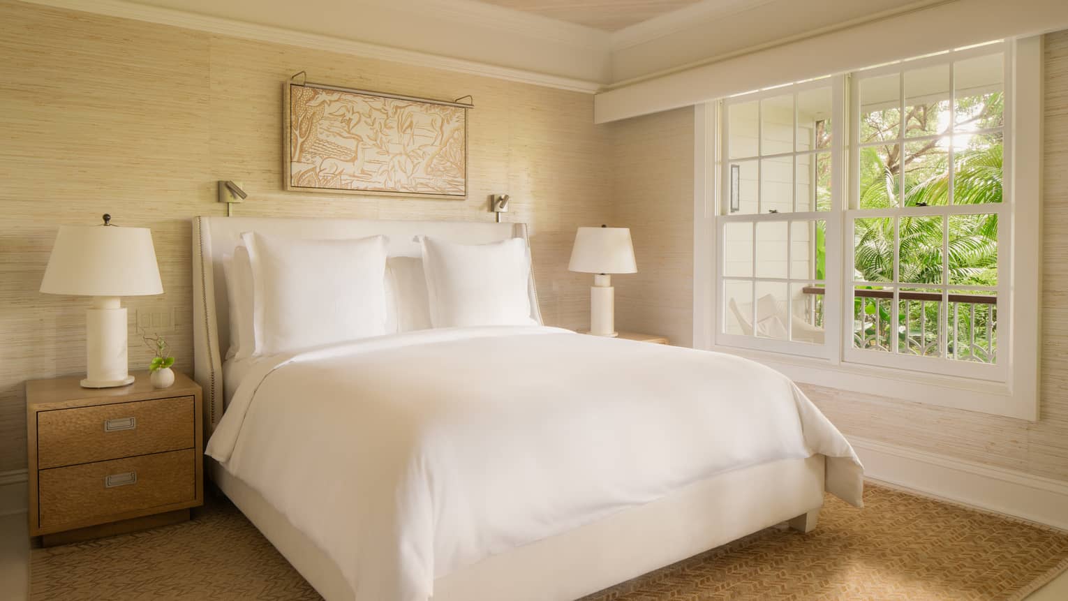 Light-filled luxury bedroom with king bed and garden view