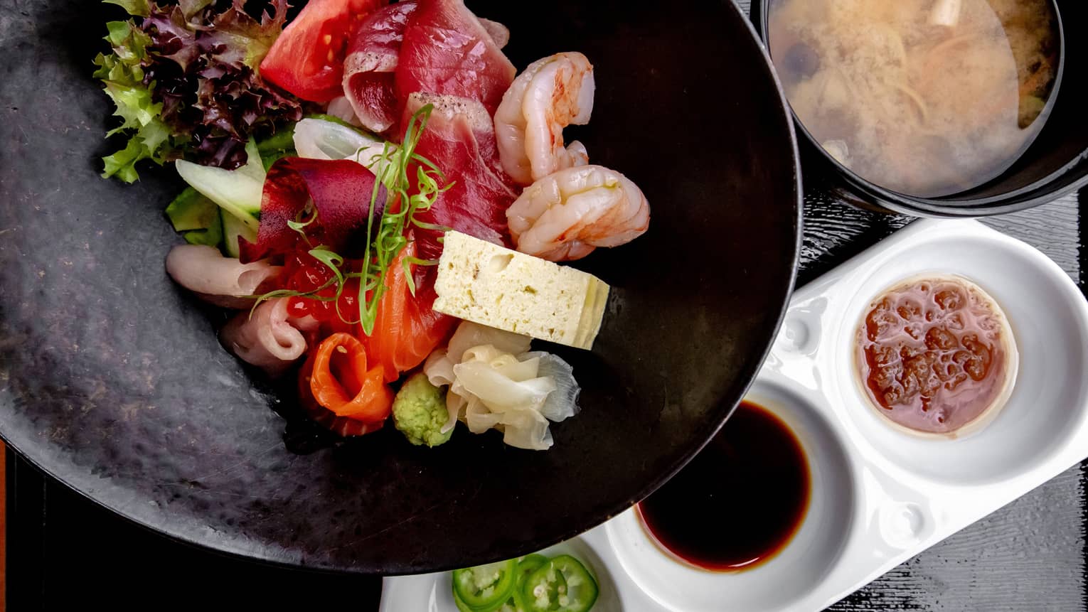 Chirashi Don, a variety of dishes including miso soup and sashimi