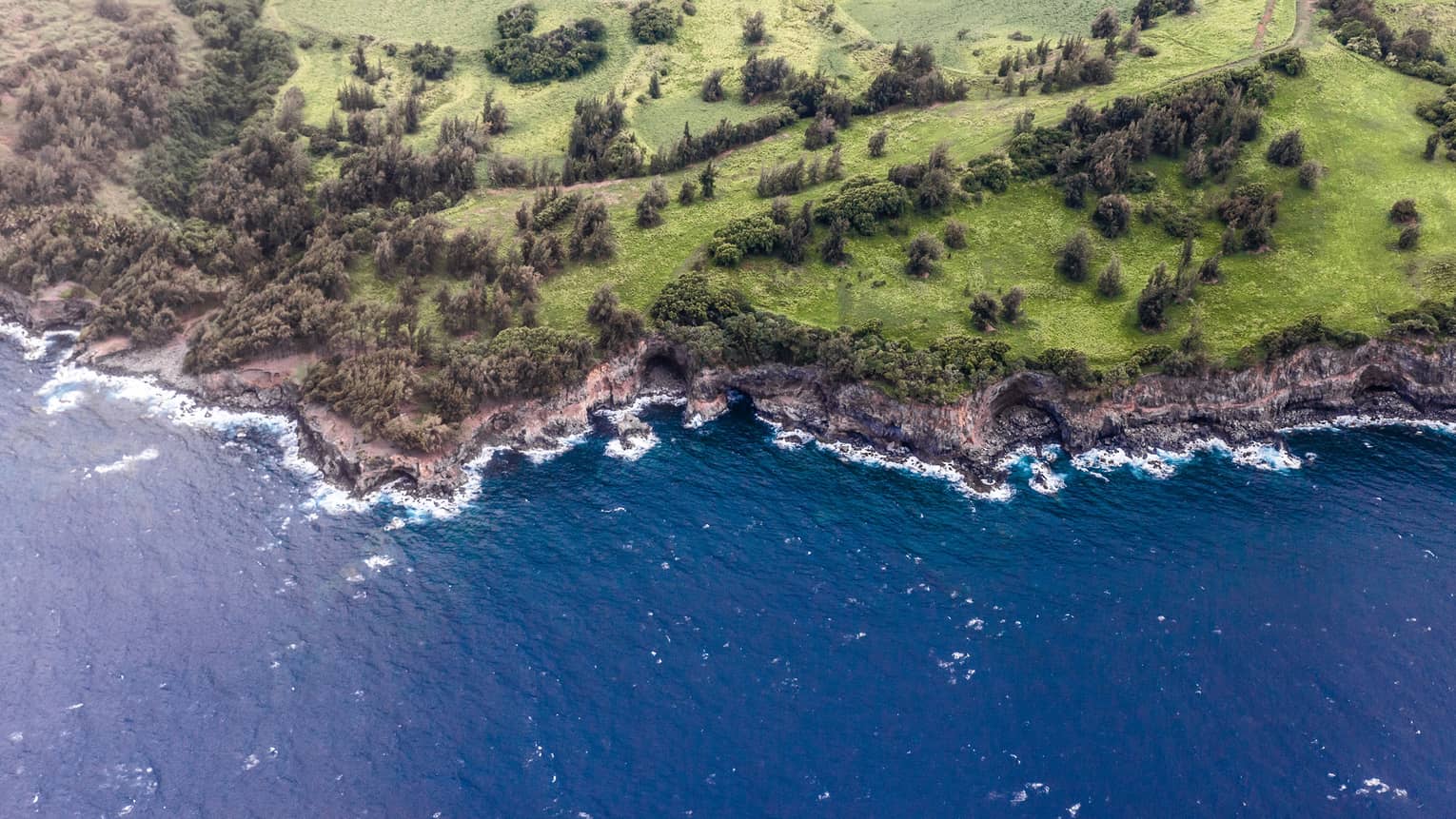 Aerial view of Hualalai, Hawaii rocky shoreline and ocean