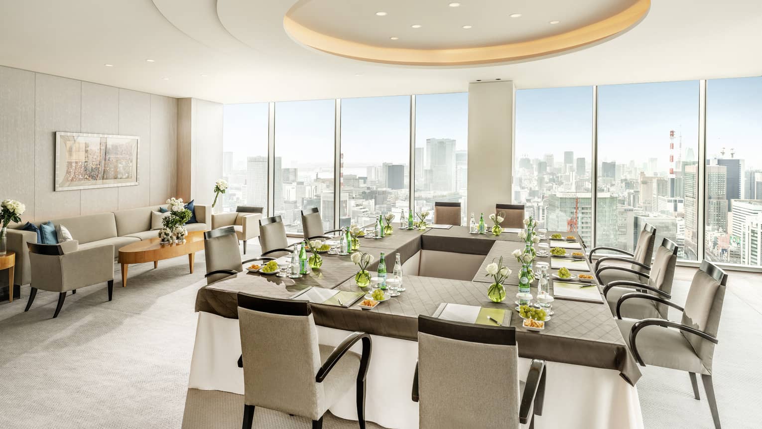 Executive Dining Room with hollow square table, floor-to-ceiling windows with city views