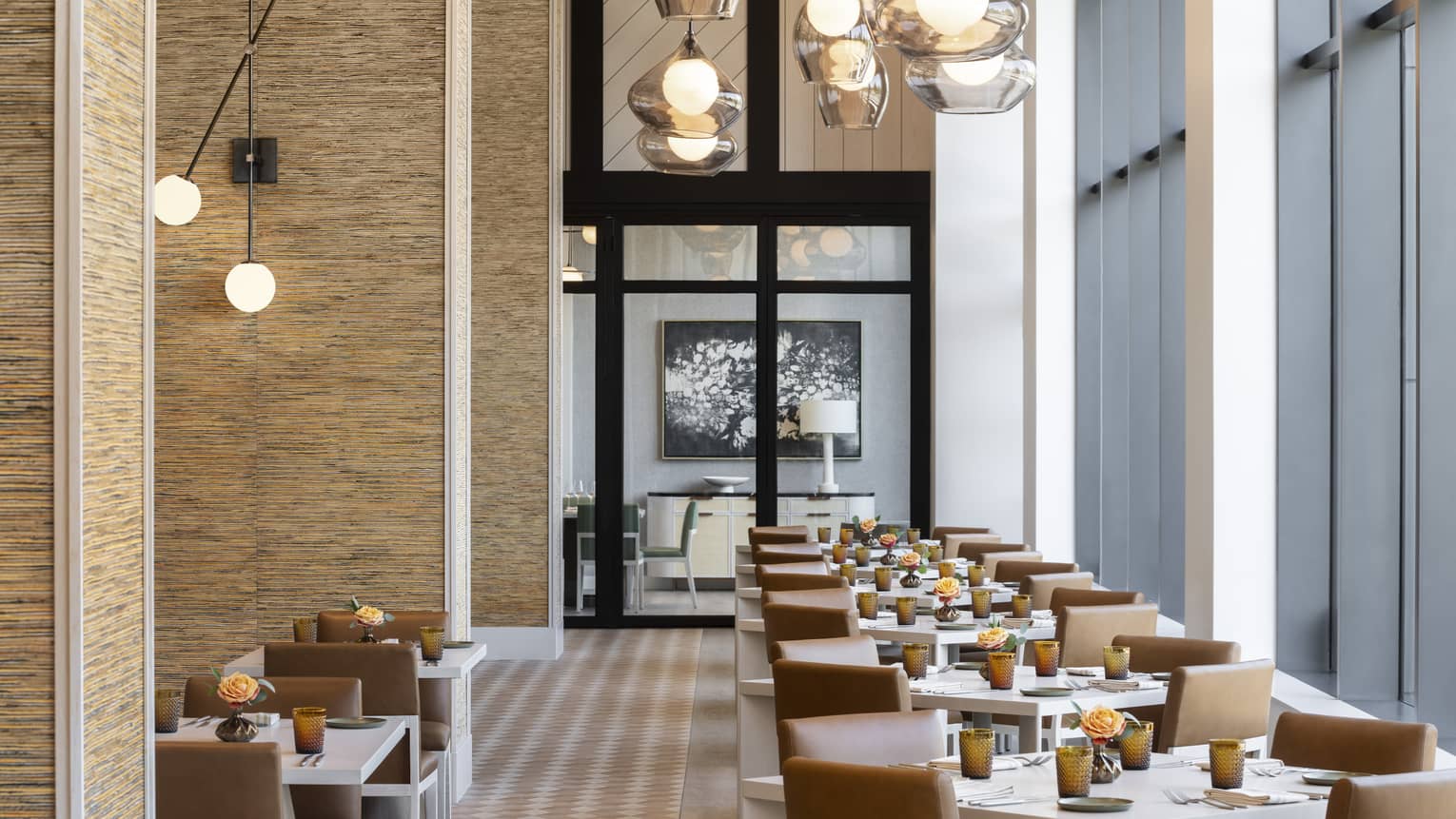 Restaurant lined with tables of four