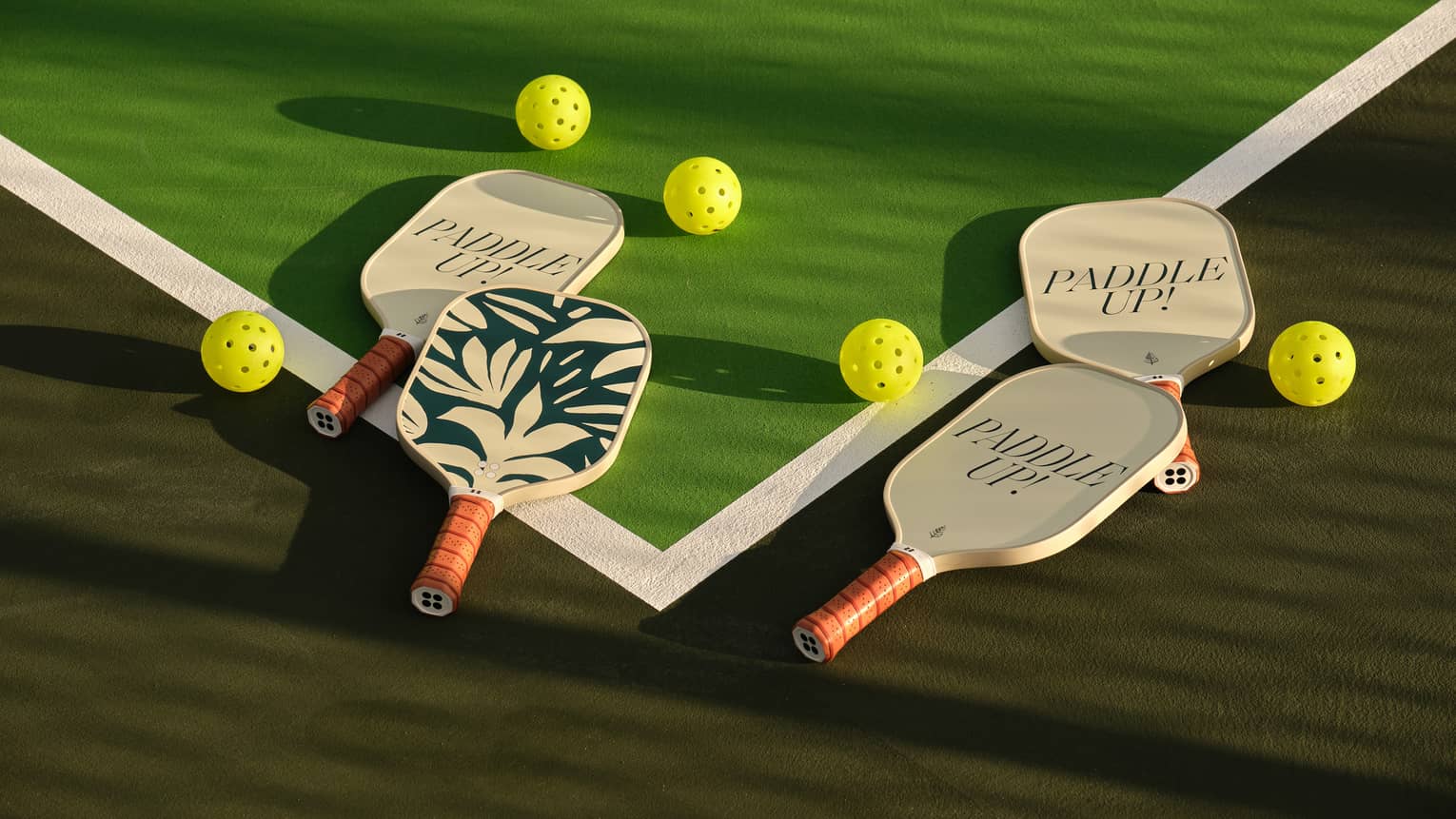 Pickleball paddles on a pickleball court